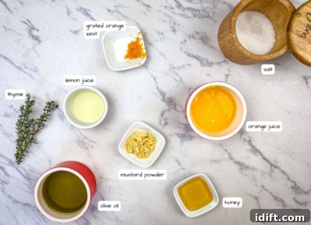 Golden Autumn Salmon Bowl 6 Ingredients for the refreshing citrus dressing, including orange juice, lemon juice, mustard powder, honey, orange zest, salt, olive oil, and fresh thyme, neatly arranged and labeled on a kitchen counter.