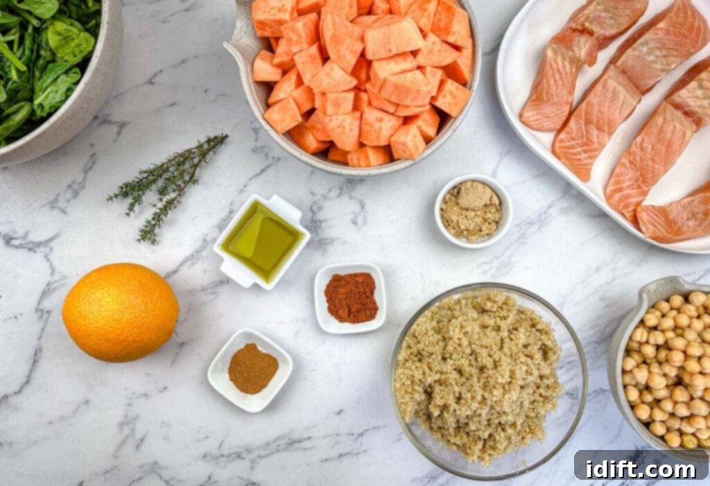 Golden Autumn Salmon Bowl 7 A comprehensive flat lay of all fresh and pantry ingredients required for the Fall Harvest Salmon Bowl, neatly arranged on a clean wooden surface, ready for preparation.