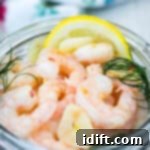A jar with a pickled shrimp.