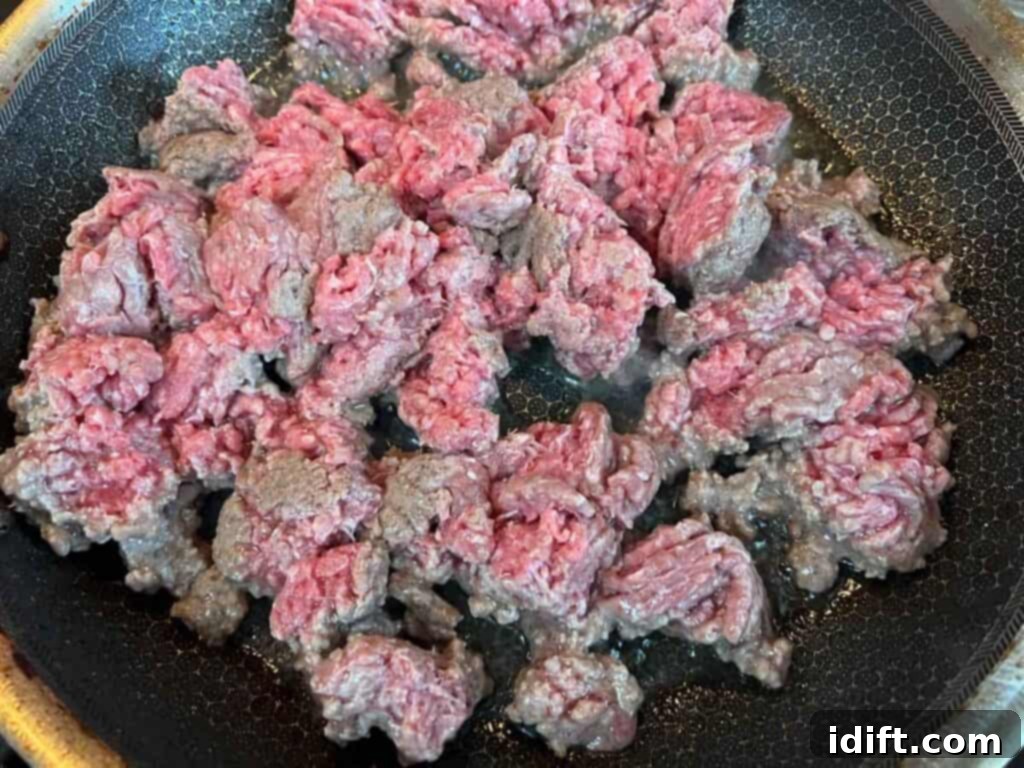 Browning ground beef in a skillet for chili.