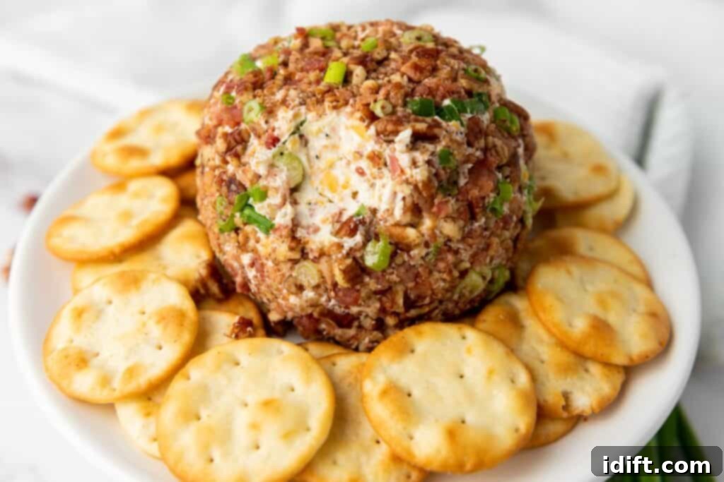 A Pecan Bacon Cheeseball with crackers around.