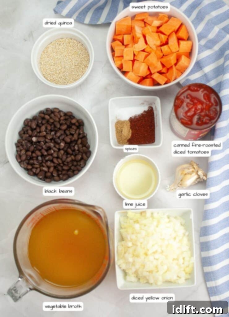A selection of fresh and canned ingredients for Sweet Potato Chili with Quinoa, including diced sweet potato, chopped onion, garlic, black beans, fire-roasted tomatoes, quinoa, corn, and spices, all clearly labeled.