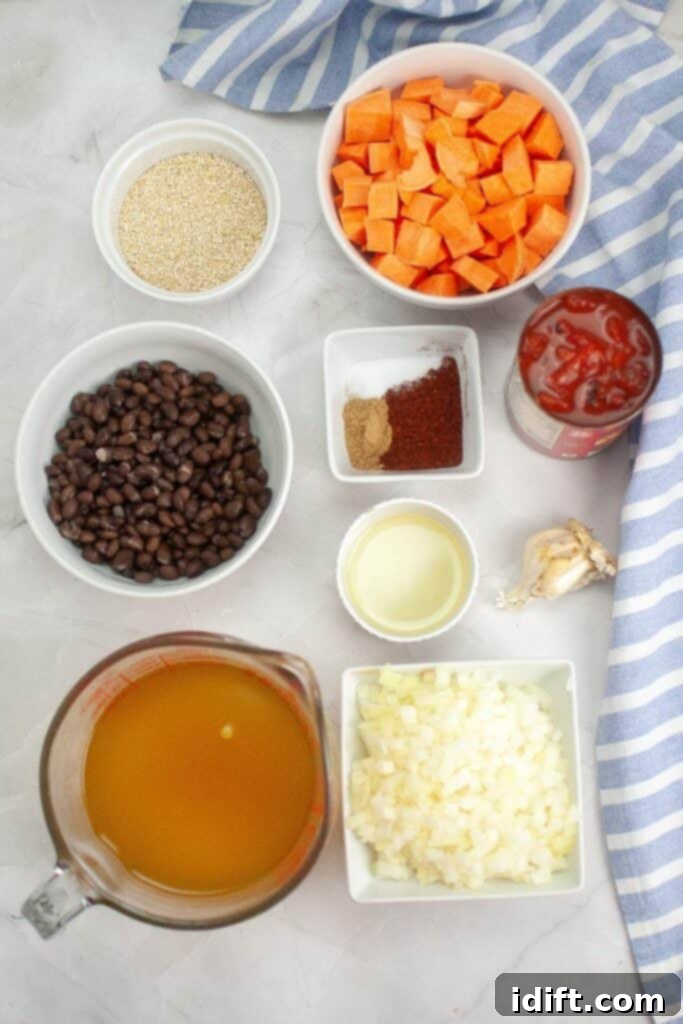 All the fresh and canned ingredients for Sweet Potato Chili with Quinoa laid out on a countertop, ready for preparation.