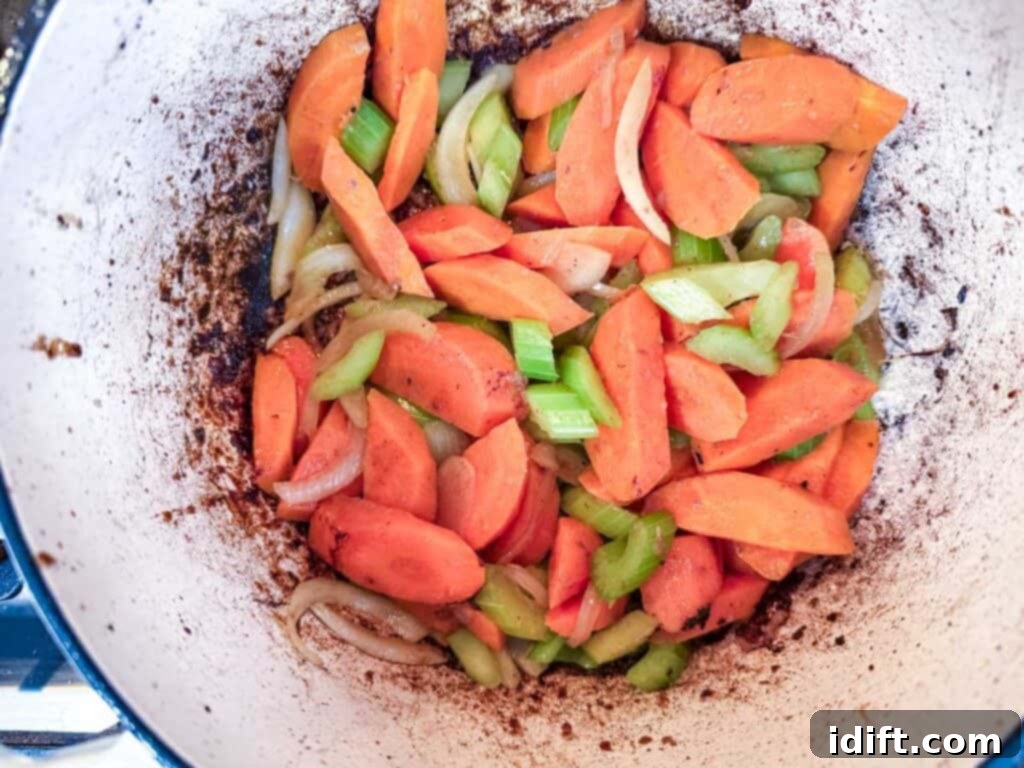 Add the diced onion, carrot, and celery to the pot.