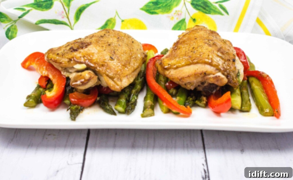 Roasted Garlic Chicken and Asparagus 2 Succulent garlic chicken and crisp asparagus elegantly plated, ready to be enjoyed.