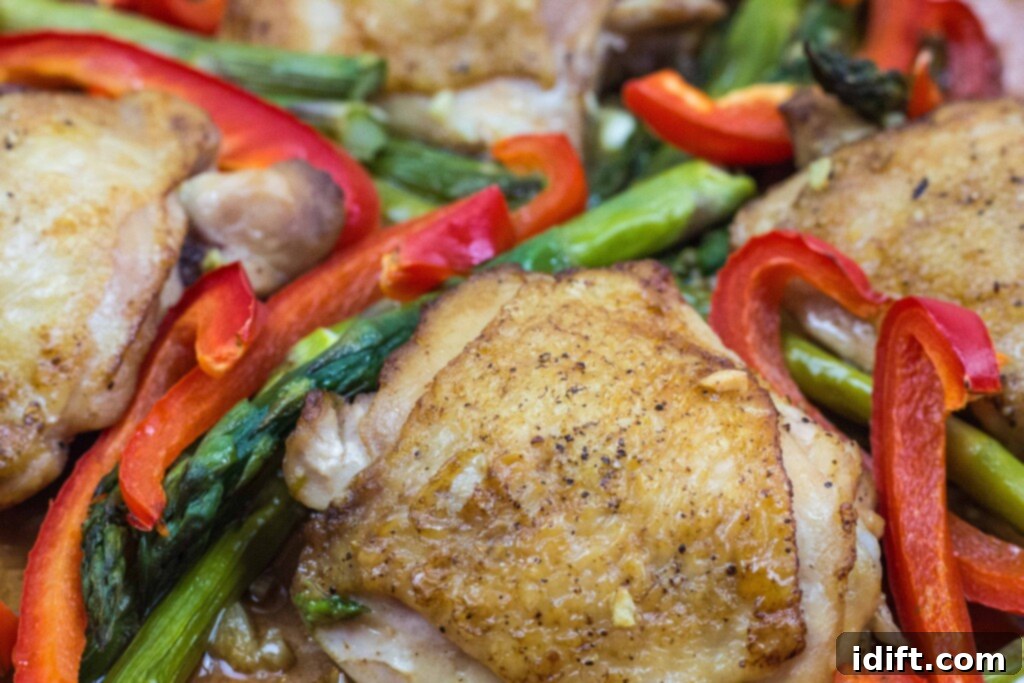 Roasted Garlic Chicken and Asparagus 9 A perfectly cooked garlic chicken and asparagus skillet meal, ready to be served and savored.