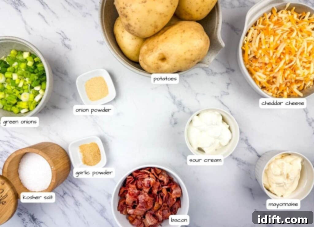 Labeled ingredients laid out on a table: Nonstick spray, bacon, mayonnaise, sour cream, salt, onion powder, garlic powder, green onions, sharp cheddar cheese, and diced potatoes.