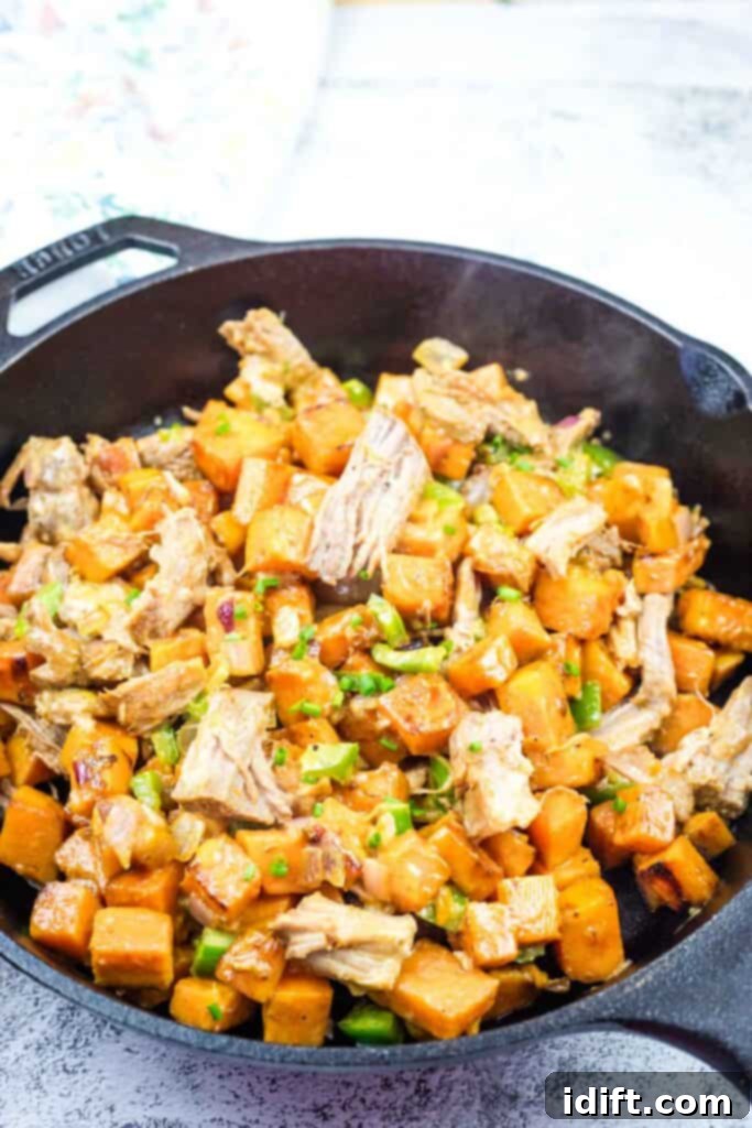 A skillet of Sweet Potato Hash with Pulled Pork & Chipotle Butter.