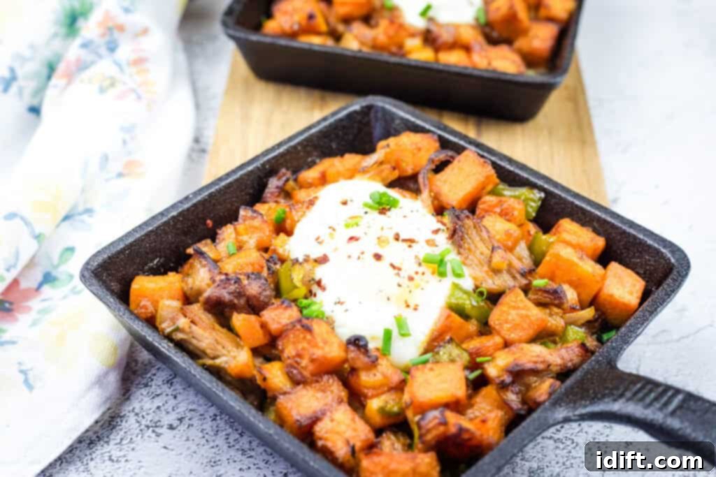 Two small skillets of Sweet Potato Hash with Pulled Pork & Chipotle Butter.