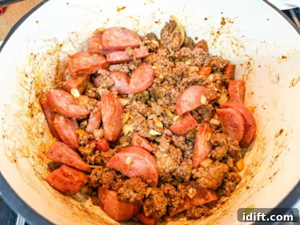 Robust Texas Campfire Stew 6 Add the smoked sausage, spices, and veggies.