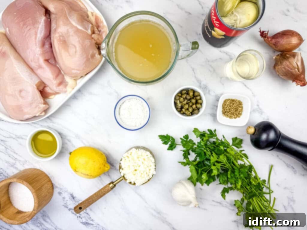 Ingredients laid out on a clean marble surface, including raw chicken breasts, chicken broth, artichoke hearts, shallots, capers, dried oregano, garlic, lemon, parsley, feta cheese, olive oil, salt, and pepper.
