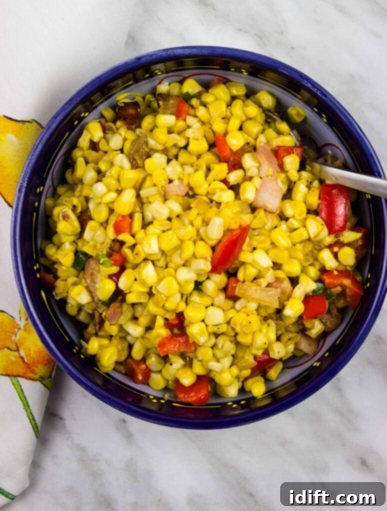 texas corn succotash in a dark blue serving bowl