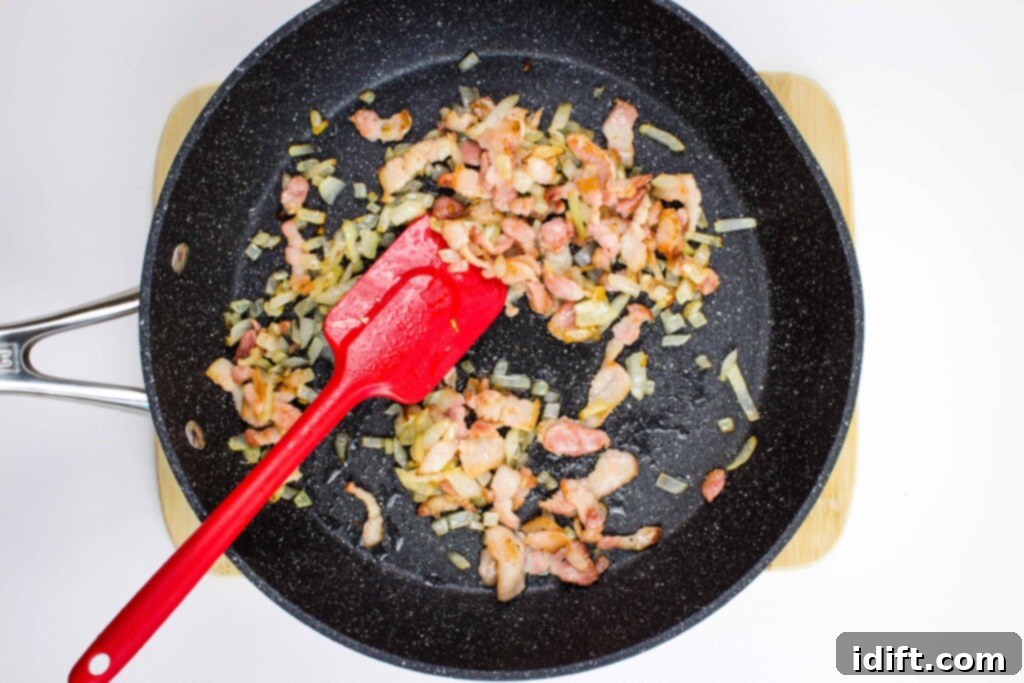 pan frying the bacon, onions, garlic, and jalapeno