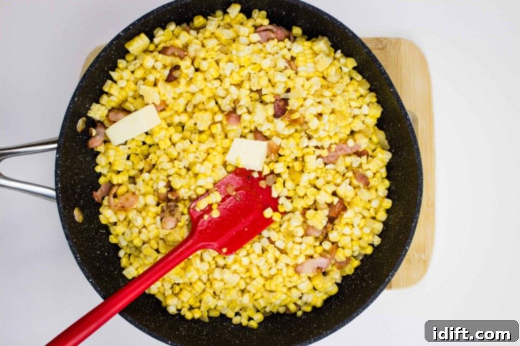 adding the butter and corn to the pan