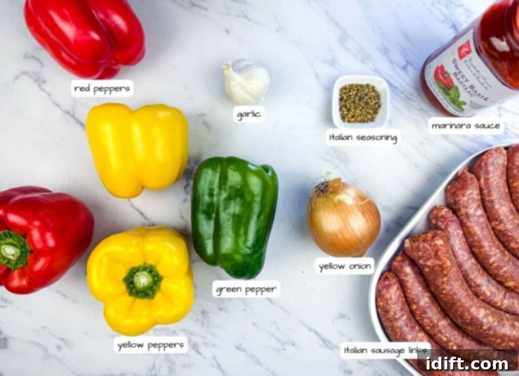 Ingredients arranged on a marble surface: red and yellow bell peppers, green pepper, garlic, yellow onion, Italian sausage links, Italian seasoning, and marinara sauce. All fresh and ready for cooking.