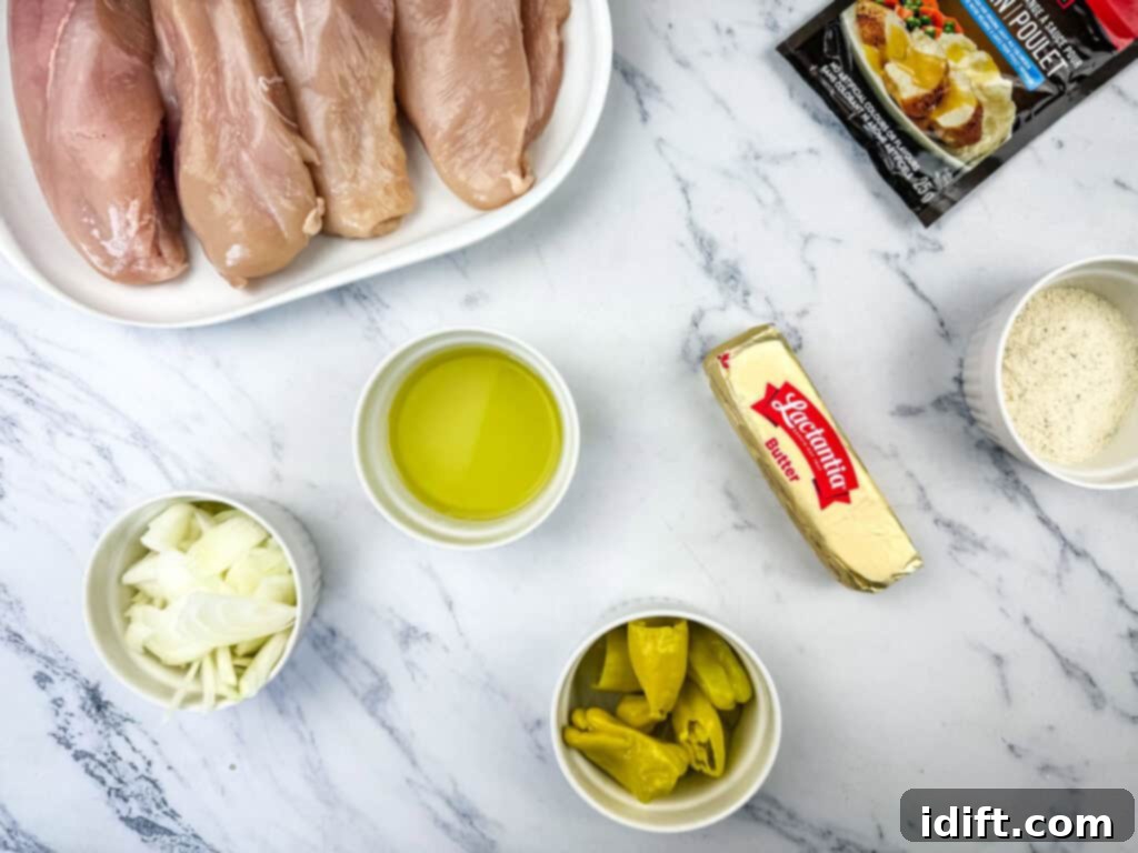 Raw chicken breasts on a plate, with small bowls of sliced onions, olive oil, chopped peppers, grated cheese, a stick of butter, and a seasoning pack on a marble surface.