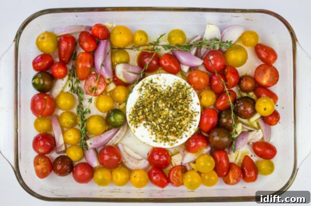 tomatoes, garlic, shallot and block of feta in a baking dish