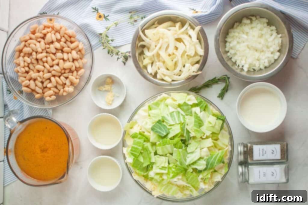 A comprehensive flat lay of ingredients for Cabbage and Bean Soup, featuring white cannellini beans, precisely sliced onion, finely chopped cabbage, rich broth, smooth cream, minced garlic, golden oil, zesty lemon, aromatic thyme sprigs, a fragrant rosemary sprig, and essential salt and pepper, all ready for cooking.