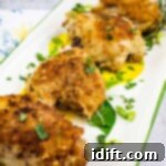 Oven baked chicken with creamy onion gravy on a platter