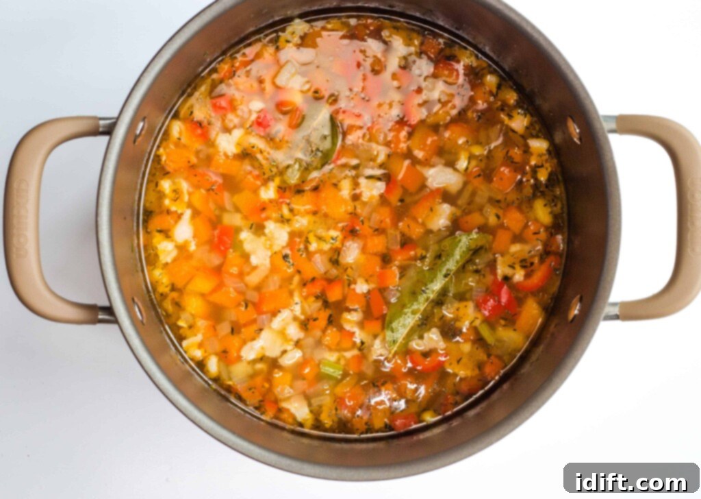 Smoky Chipotle Shrimp and Corn Chowder 5 All the ingredients added into the pot, simmering together to create a flavorful chowder base.