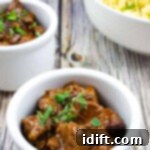 Hearty Hungarian Goulash 10 Authentic Hungarian Goulash in white serving bowls with spaetzel in the background