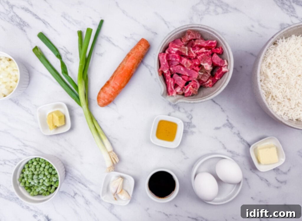 Steakhouse Fried Rice 5 Rice, sliced steak, carrot, oil, eggs, butter, soy sauce, garlic, peeled ginger, sliced onion, green onion, and peas on a marbled white-gray surface