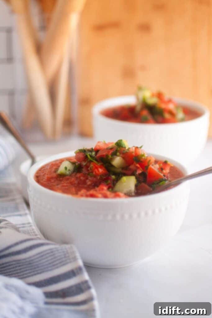 Cool and Refreshing Gazpacho 2 Photo of delicious and refreshing Classic Gazpacho, garnished with fresh herbs and a swirl of olive oil.
