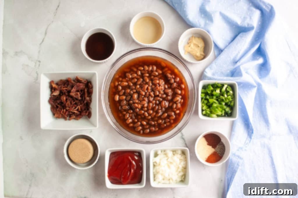 Homestyle Bean Bake 5 A bowl of plain baked beans is centrally placed, surrounded by small, neatly arranged bowls containing ingredients like crispy chopped bacon, vibrant green bell pepper, diced onion, a dollop of rich ketchup, brown sugar, various spices, tangy mustard, apple cider vinegar, and savory Worcestershire sauce, all set on a marble surface. This image beautifully captures the organized preparation of ingredients for the baked bean casserole.