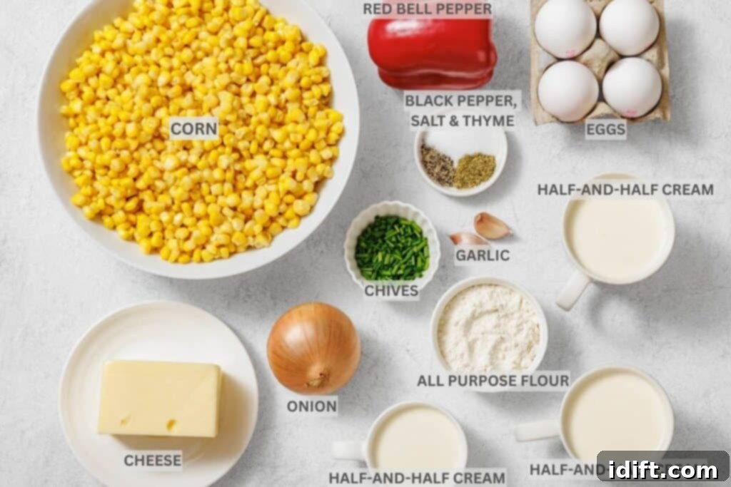 Creamy Golden Corn Bake 4 Assorted labeled ingredients for a recipe, including corn, red bell pepper, eggs, cheese, onion, chives, garlic, flour, half-and-half cream, and seasonings arranged on a white surface.