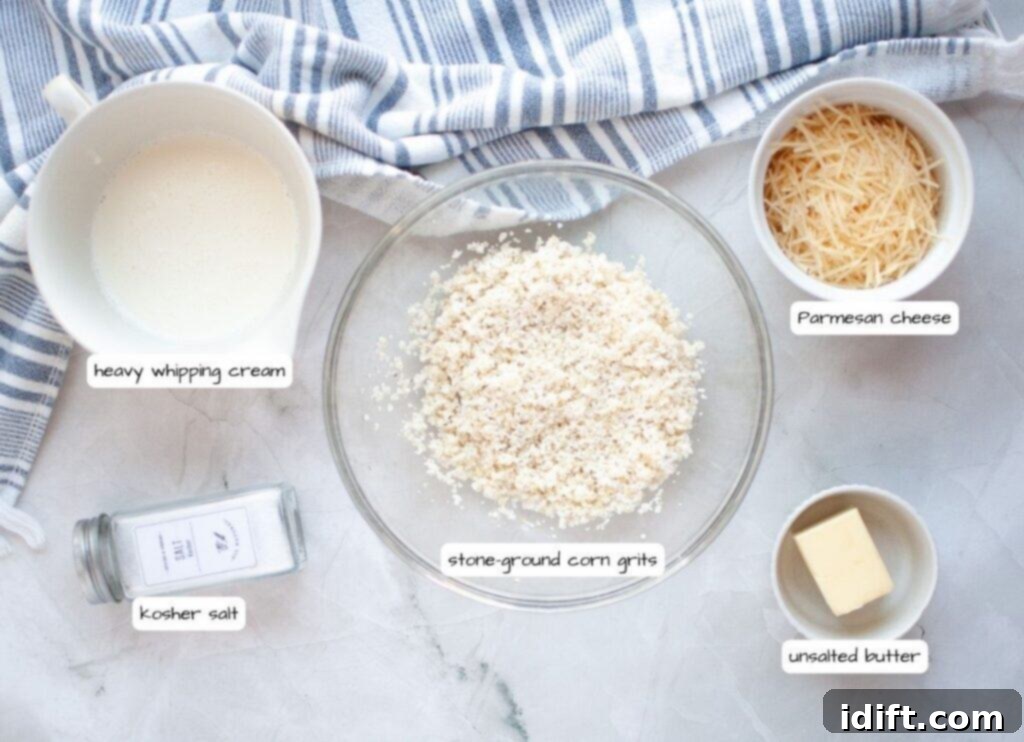 Overhead shot of labeled ingredients for stone ground corn grits: grits, heavy cream, Parmesan cheese, unsalted butter, and kosher salt.