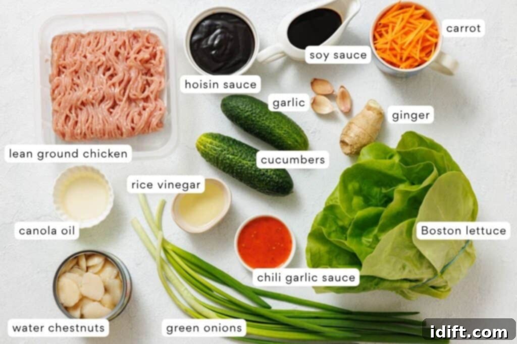 Ingredients for a lettuce wrap on a white surface.