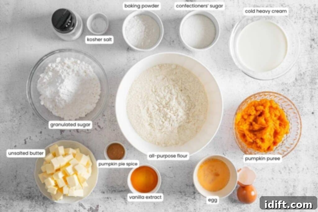 Various baking ingredients, including flour, sugars, pumpkin puree, butter, egg, cream, vanilla extract, spices, baking powder, and salt, arranged in separate bowls on a white surface.