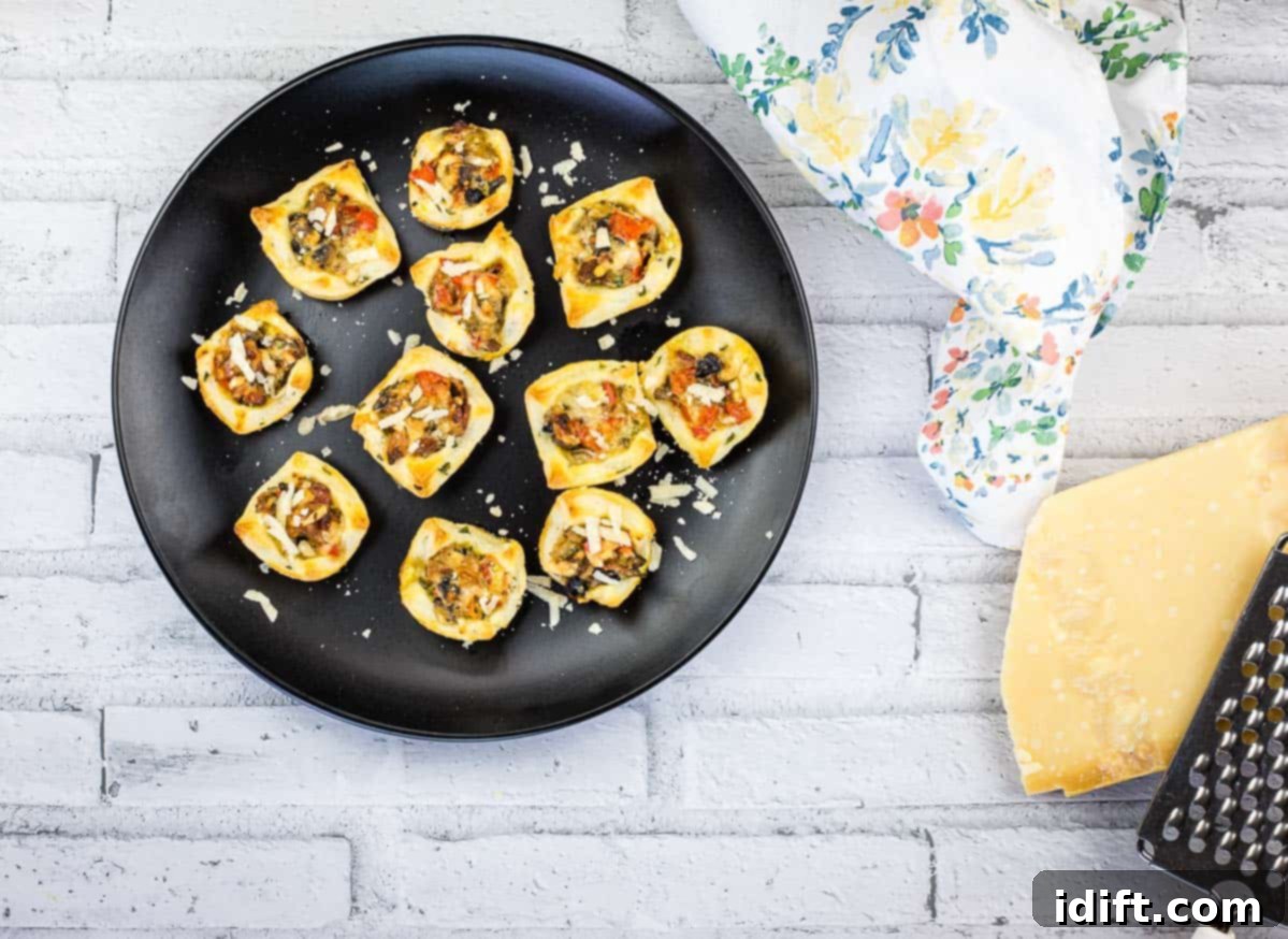21 Halloween Bites So Good They'll Vanish Before Any Costume Compliments 22 A black plate with bacon and mushroom tartlets on it.
