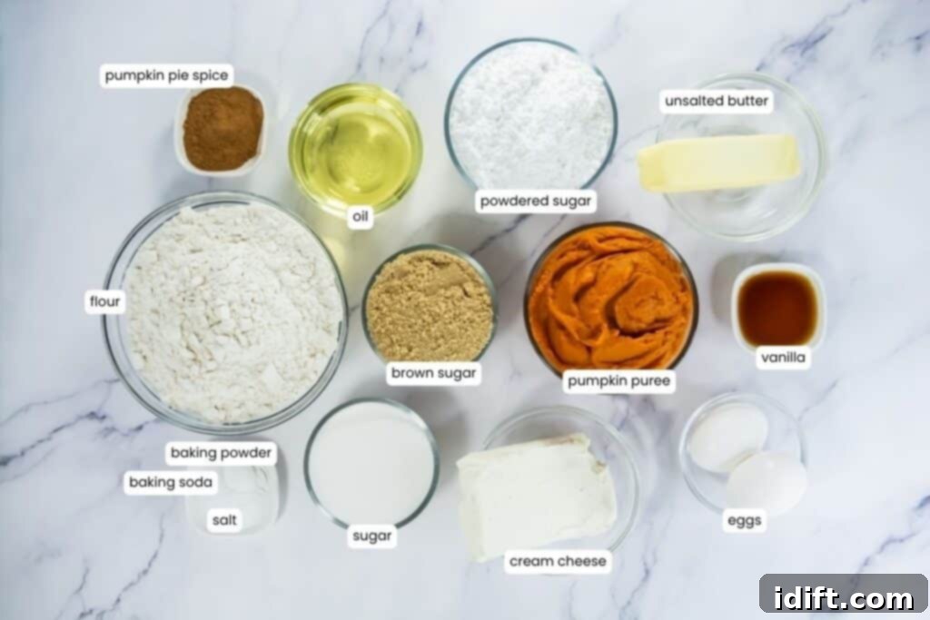 Overhead view of labeled pumpkin whoopie pie ingredients in glass bowls on a marble surface.
