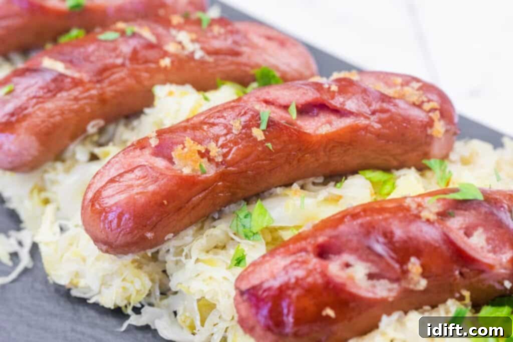 Grilled sausages served on a bed of sauerkraut, garnished with chopped parsley.