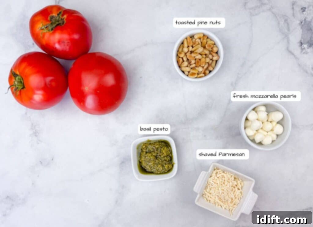 An overhead shot showcasing fresh tomatoes, small bowls of toasted pine nuts, a rich green basil pesto, and creamy mozzarella cheese pearls, all ready for assembling a delicious dish.