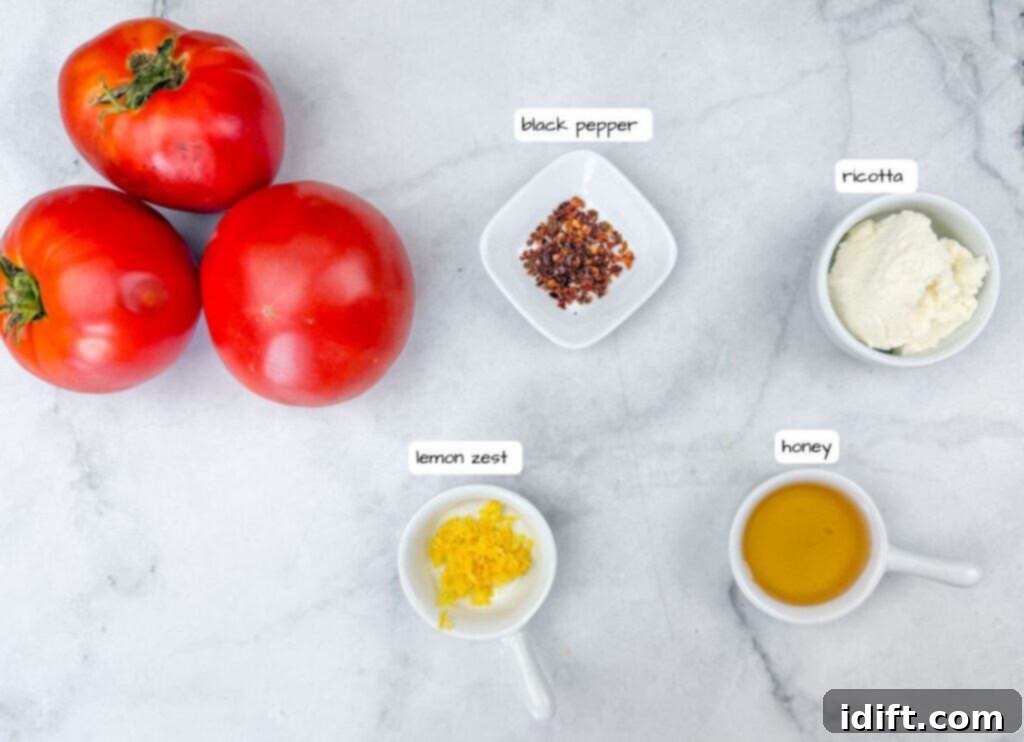 A vibrant arrangement of three ripe red tomatoes alongside small bowls containing fresh black pepper, creamy ricotta cheese, bright lemon zest, and golden honey. All items are meticulously arranged on a sophisticated marble surface with labeled tags for easy identification.