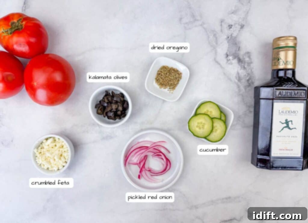A vibrant selection of ingredients for a tomato flight, featuring bowls of crumbled feta, sliced cucumbers, pickled red onions, Kalamata olives, and a shaker of dried oregano, all ready for assembly.