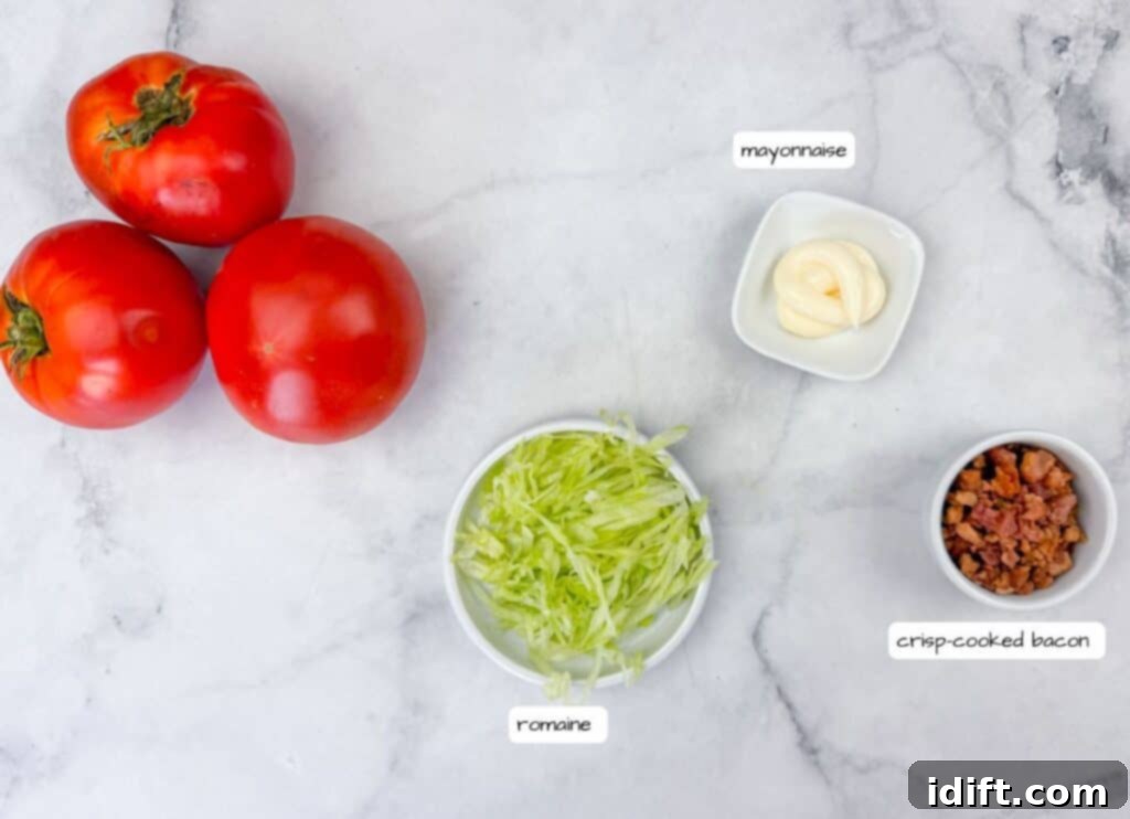 A delightful collection of fresh tomatoes and essential salad ingredients, including crisp lettuce and savory bacon, artfully arranged and ready for a delicious meal.