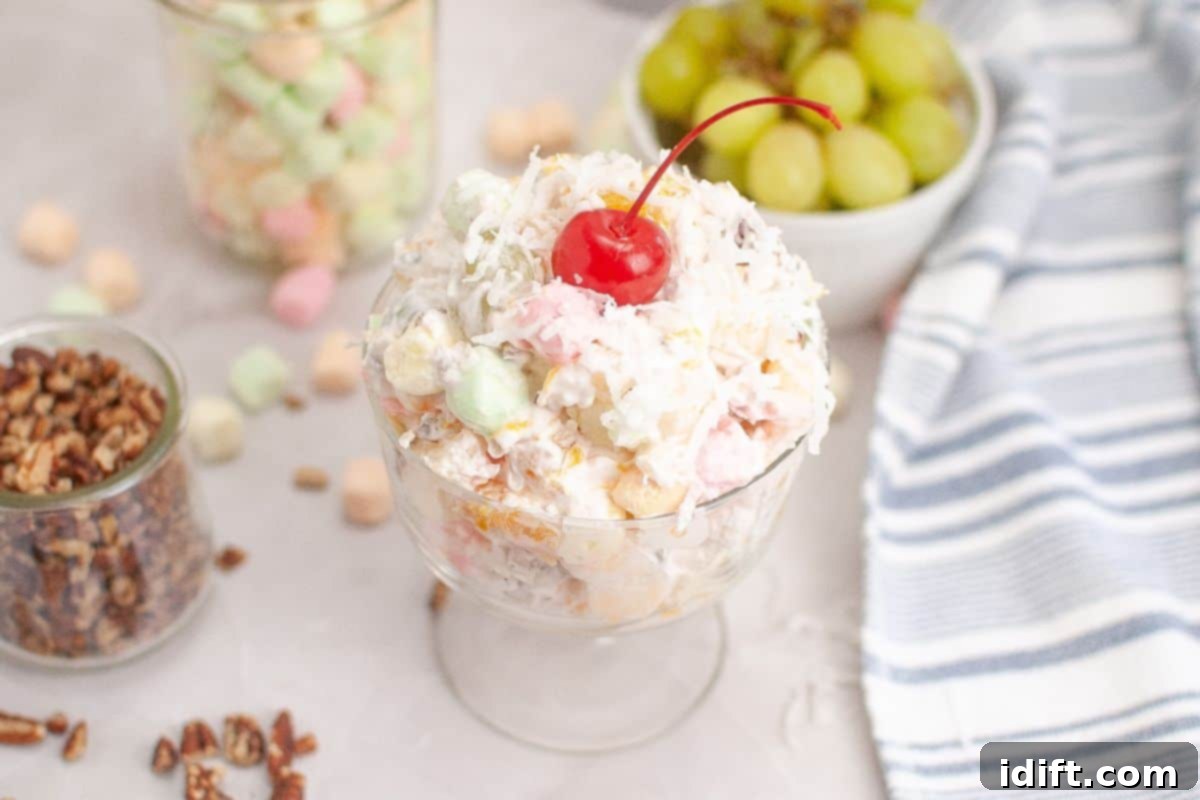 23 Quick & Easy Dinner Salads 5 Colorful and creamy Ambrosia Salad in a bowl.