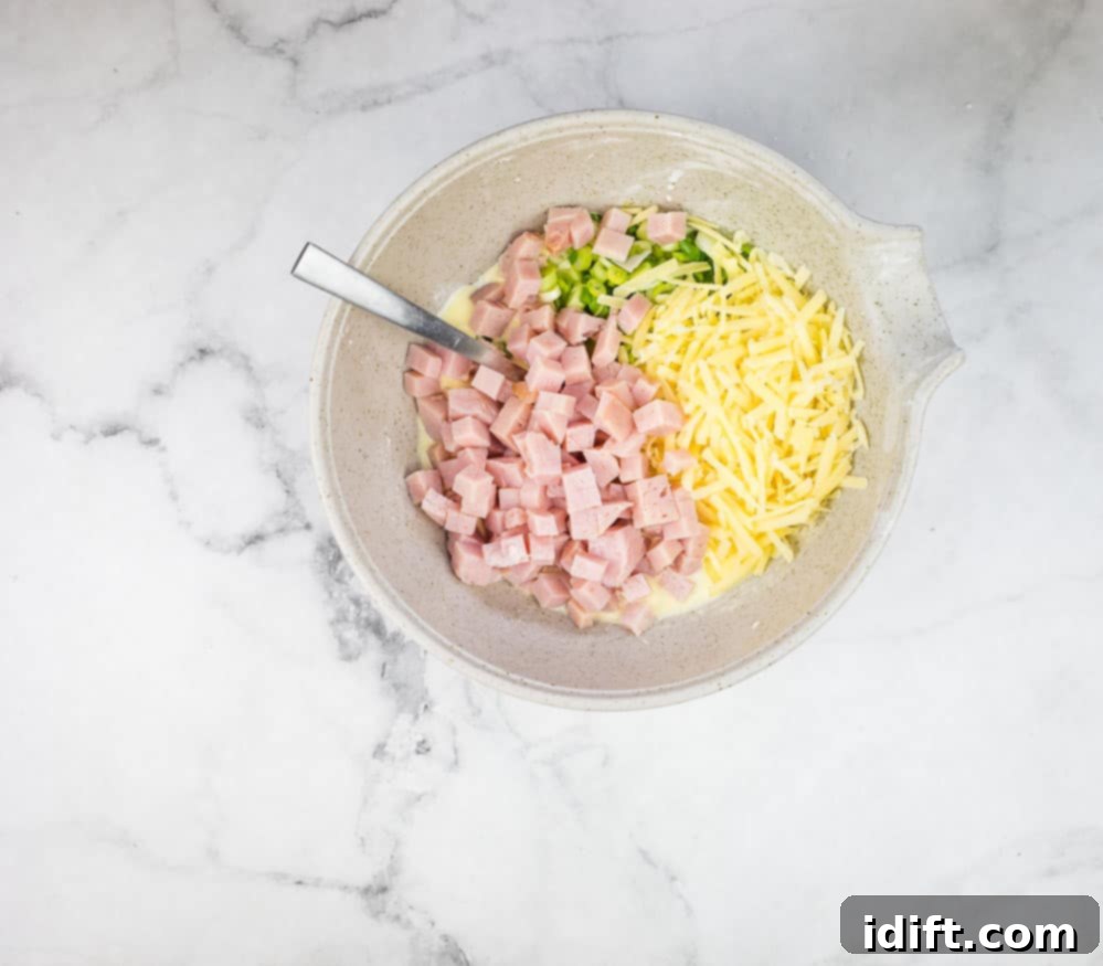 Ham, cheese, and green onions and wet ingredients mixed together