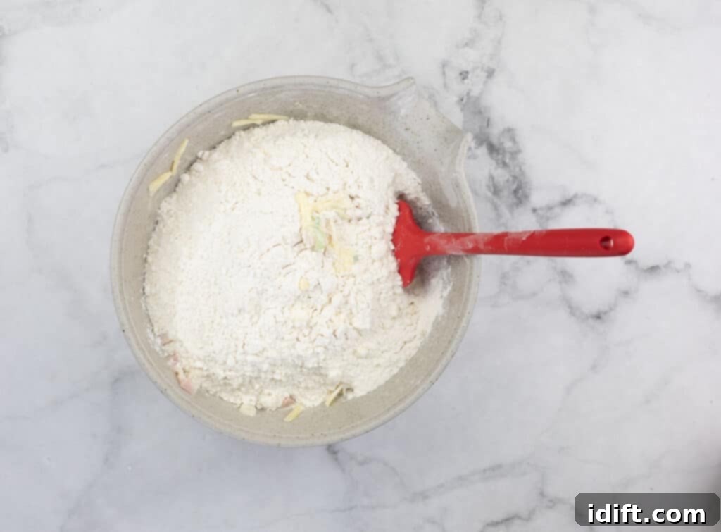 Wet and dry ingredients in a bowl about to be mixed